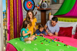 Family Plays with LEGO in a Princess Themed Patio Room