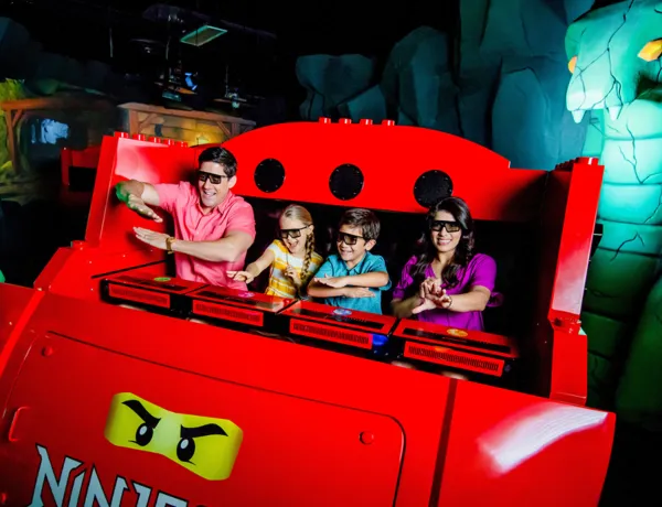 Family riding LEGO NINJAGO The Ride