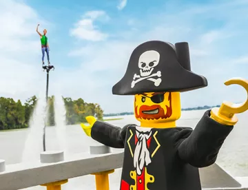 Captain Brickbeard shows off a member of his motley crew on a fly board