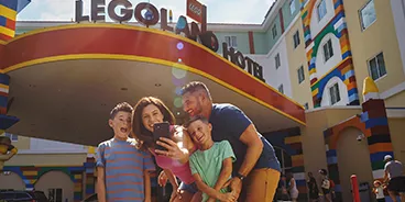 Family Takes a Selfie Outside the LEGOLAND Hotel