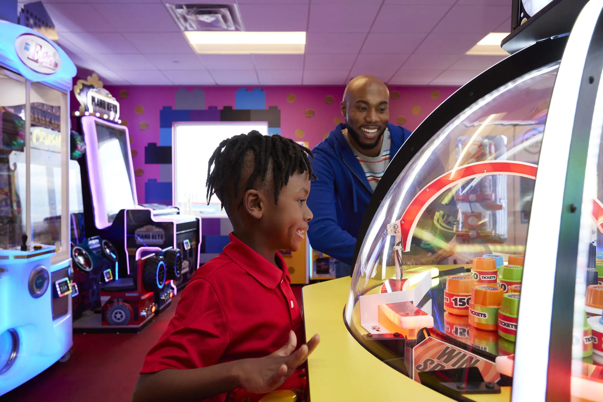 Dad and Son in Hotel Arcade